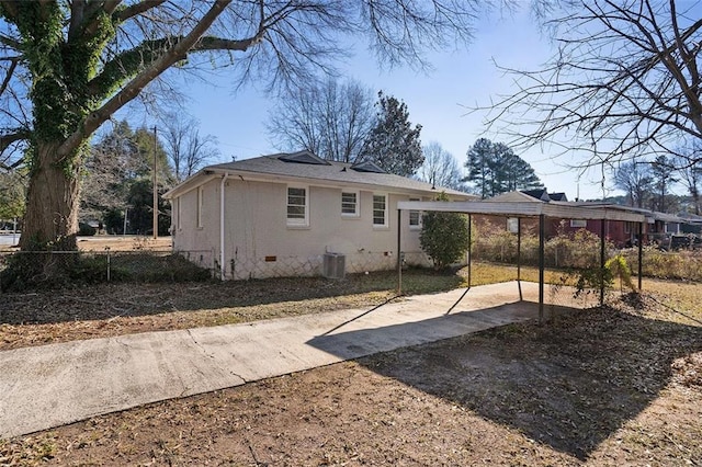 rear view of property featuring central AC unit