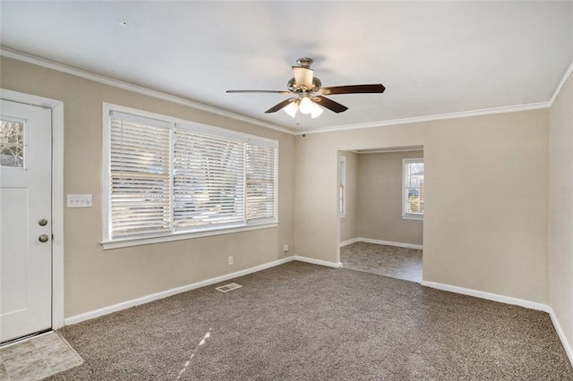 interior space with ceiling fan and ornamental molding