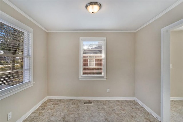 unfurnished room with crown molding