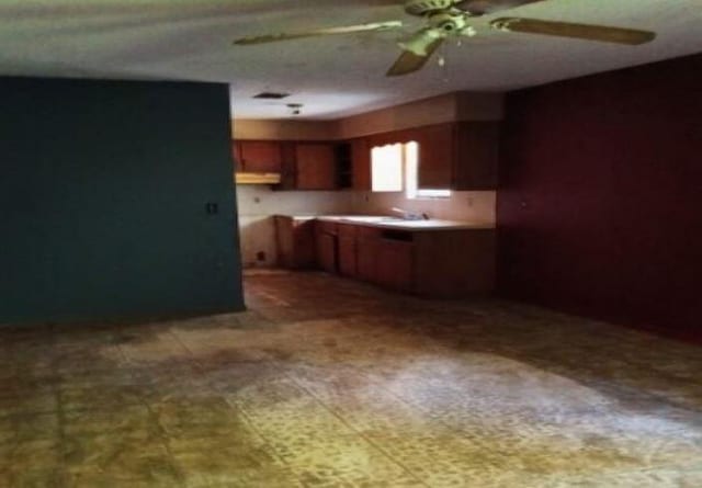 94 Roscoe Lee Cir, Wetumpka, AL 36092 - kitchen with ceiling fan, tile patterned floors, brown cabinets, and a sink