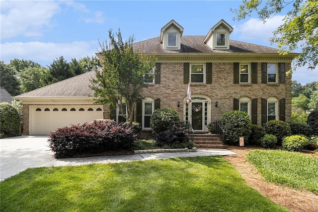 5396 Amhurst Dr, Peachtree Corners, GA 30092 - georgian-style home featuring brick siding, concrete driveway, an attached garage, and a front yard
