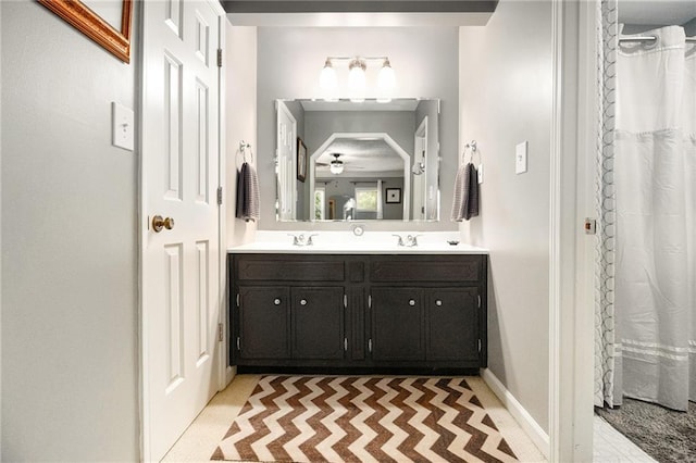 5396 Amhurst Dr, Peachtree Corners, GA 30092 - bathroom featuring double vanity and ceiling fan