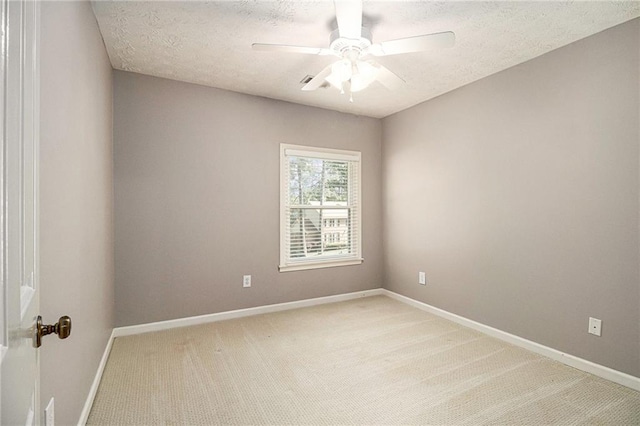 5396 Amhurst Dr, Peachtree Corners, GA 30092 - empty room featuring light colored carpet, a ceiling fan, and a textured ceiling