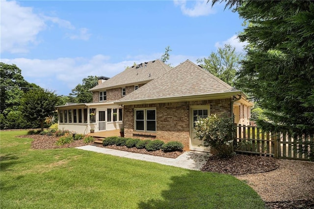 5396 Amhurst Dr, Peachtree Corners, GA 30092 - back of property featuring a sunroom, brick siding, and roof with shingles