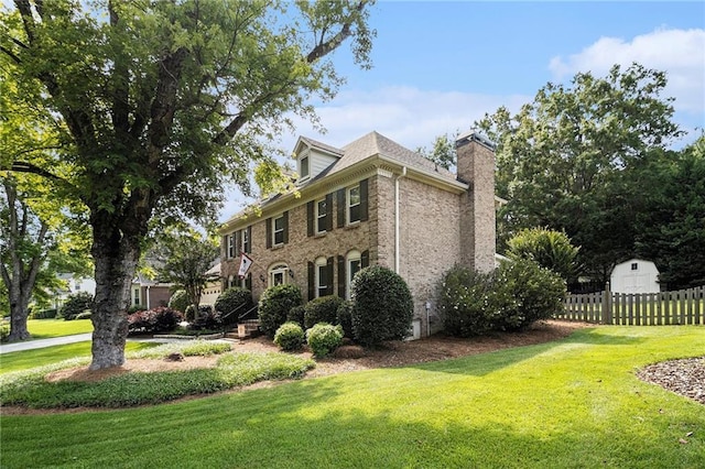 5396 Amhurst Dr, Peachtree Corners, GA 30092 - view of property exterior featuring a chimney and brick siding