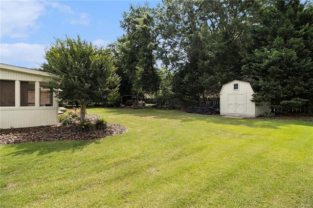 5396 Amhurst Dr, Peachtree Corners, GA 30092 - view of grassy yard with a storage unit