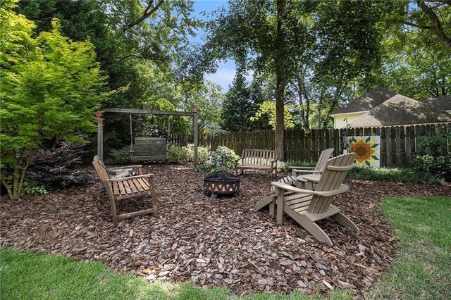 5396 Amhurst Dr, Peachtree Corners, GA 30092 - view of yard featuring an outdoor fire pit