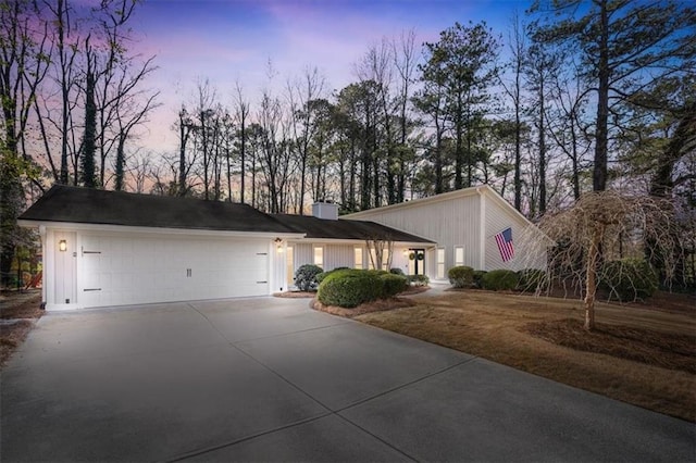 ranch-style home featuring a garage