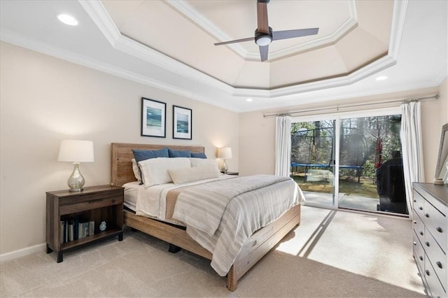 bedroom featuring a raised ceiling, crown molding, access to outside, and light colored carpet