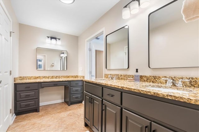 bathroom with tile patterned flooring and vanity