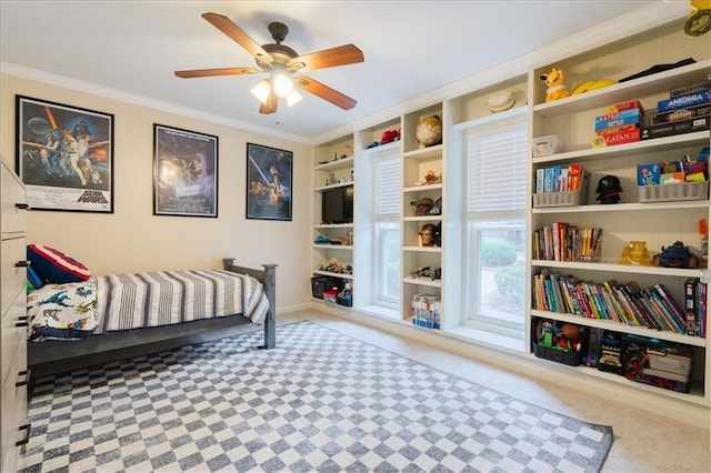 bedroom with carpet floors, ornamental molding, and ceiling fan