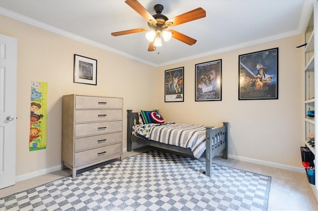 carpeted bedroom with ornamental molding and ceiling fan