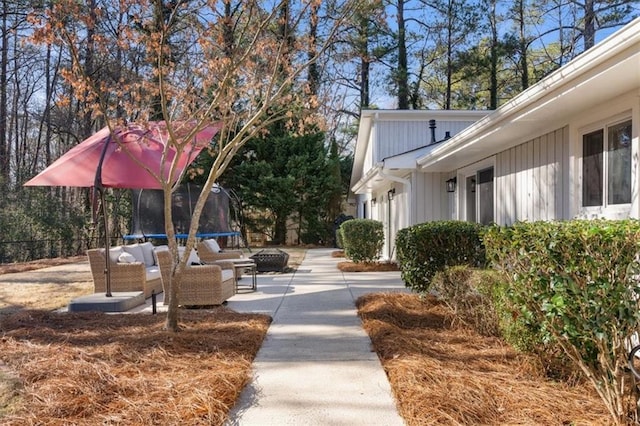 view of home's community with a patio and a trampoline