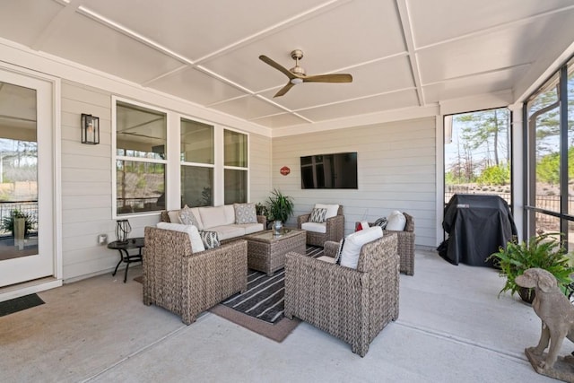 view of patio featuring grilling area, an outdoor living space, and a ceiling fan