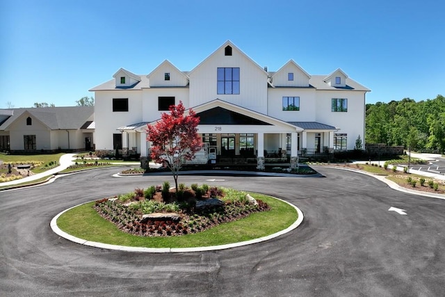 view of building exterior featuring curved driveway