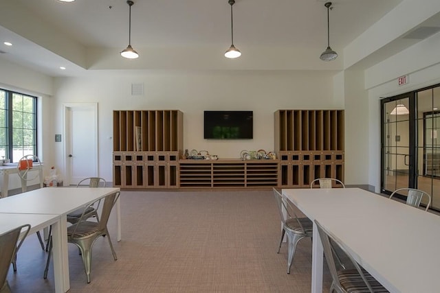 interior space with recessed lighting, a tray ceiling, and visible vents