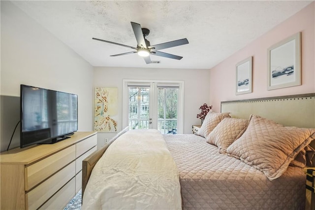 bedroom featuring ceiling fan, a textured ceiling, french doors, and access to outside