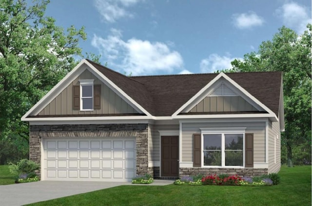 view of front of house with a front yard and a garage