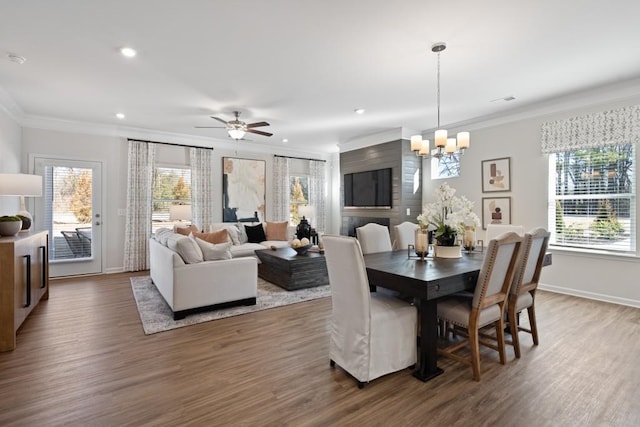 dining area with crown molding, hardwood / wood-style floors, and a healthy amount of sunlight