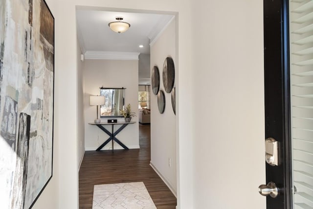 hallway with dark hardwood / wood-style floors and ornamental molding