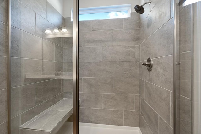 bathroom with a tile shower