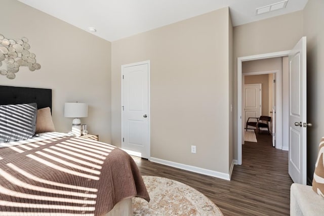 bedroom featuring dark hardwood / wood-style flooring