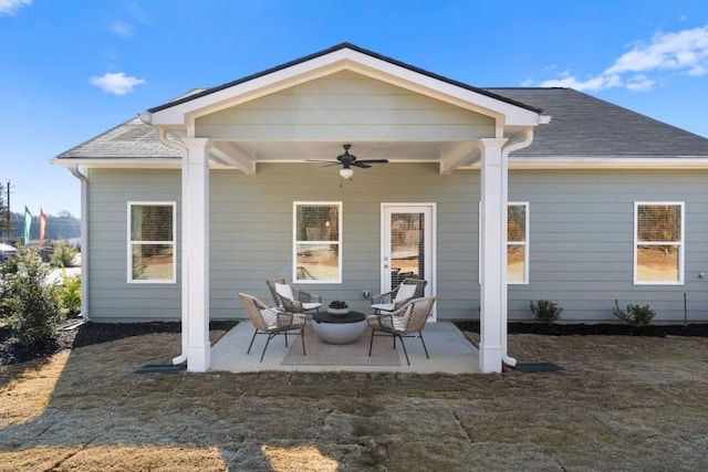 rear view of property featuring a patio area and ceiling fan