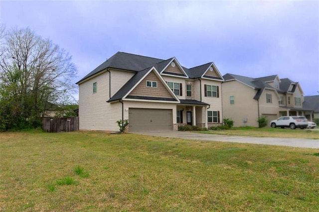 craftsman-style house featuring an attached garage, concrete driveway, and a front yard