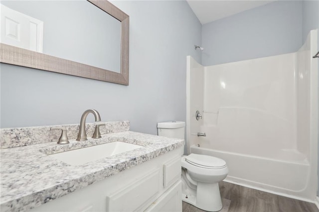 full bathroom featuring shower / tub combination, toilet, wood-type flooring, and vanity