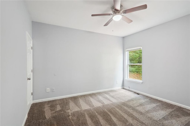 carpeted empty room with ceiling fan