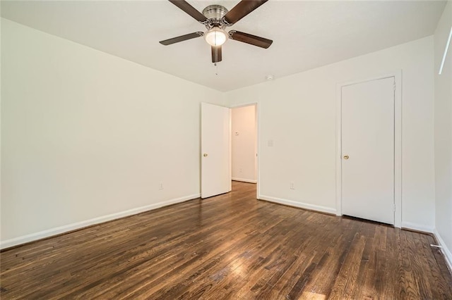 unfurnished bedroom featuring ceiling fan and dark hardwood / wood-style floors