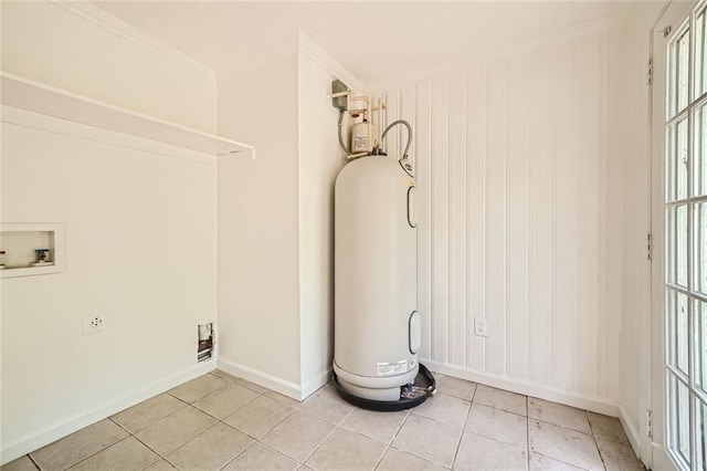 laundry area featuring hookup for a washing machine, light tile patterned floors, plenty of natural light, and crown molding