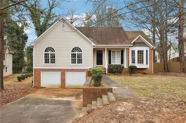 view of front of property featuring a front yard and a garage