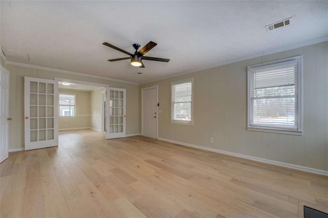4131 Carroll St, Covington, GA 30014 - unfurnished room with french doors, light wood-style flooring, a ceiling fan, and ornamental molding