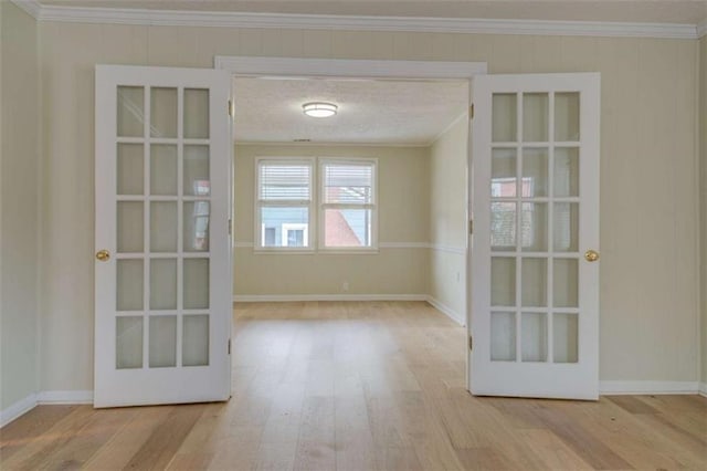 4131 Carroll St, Covington, GA 30014 - spare room featuring wood finished floors, french doors, and ornamental molding