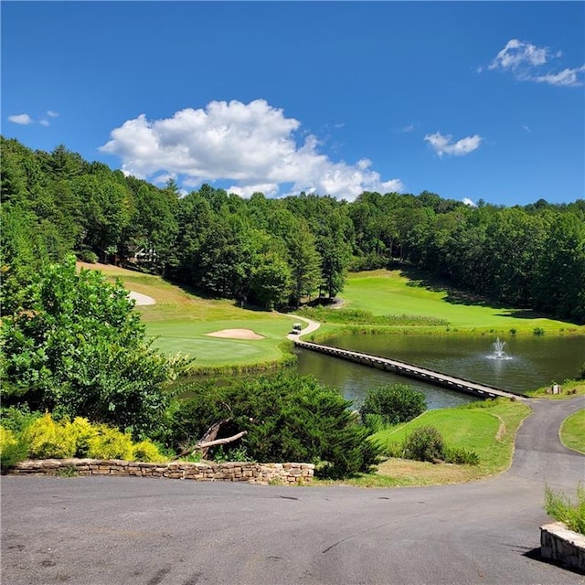 surrounding community featuring a water view