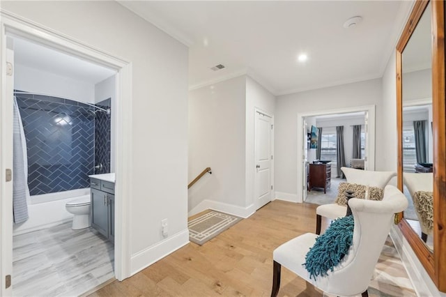 115 Harlow Cir, Roswell, GA 30076 - corridor featuring an upstairs landing, ornamental molding, baseboards, visible vents, and light wood-style flooring