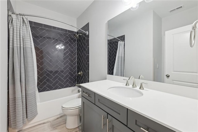 115 Harlow Cir, Roswell, GA 30076 - full bathroom featuring visible vents, toilet, wood finished floors, vanity, and shower / bathtub combination with curtain