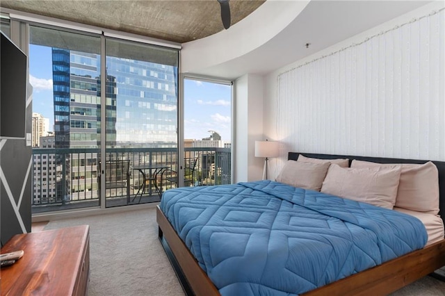 3324 Peachtree Rd NE Unit 1813, Atlanta, GA 30305 - carpeted bedroom featuring a view of city, access to exterior, floor to ceiling windows, and multiple windows