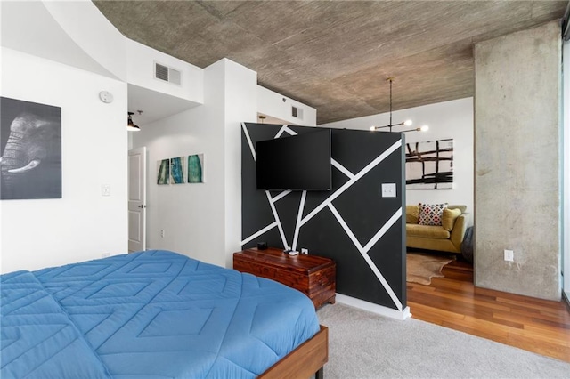 3324 Peachtree Rd NE Unit 1813, Atlanta, GA 30305 - carpeted bedroom featuring a chandelier and wood finished floors