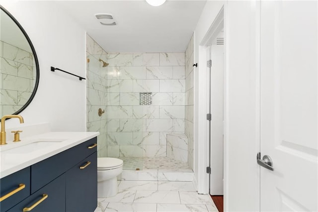 3324 Peachtree Rd NE Unit 1813, Atlanta, GA 30305 - full bath with marble look tile flooring, vanity, tiled shower, and toilet