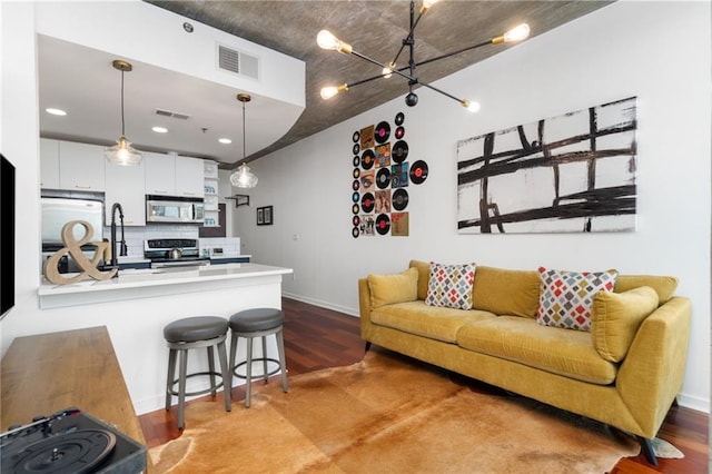 3324 Peachtree Rd NE Unit 1813, Atlanta, GA 30305 - living room with baseboards, wood finished floors, a chandelier, and recessed lighting
