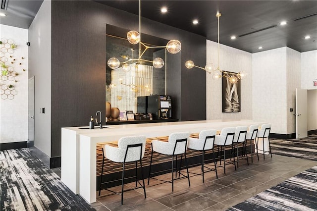 3324 Peachtree Rd NE Unit 1813, Atlanta, GA 30305 - bar area featuring a sink, baseboards, and tile patterned flooring