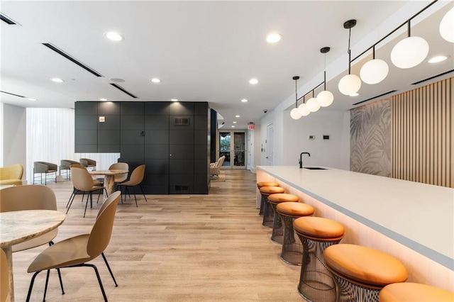 3324 Peachtree Rd NE Unit 1813, Atlanta, GA 30305 - community bar area with light wood-style flooring, hanging light fixtures, and recessed lighting