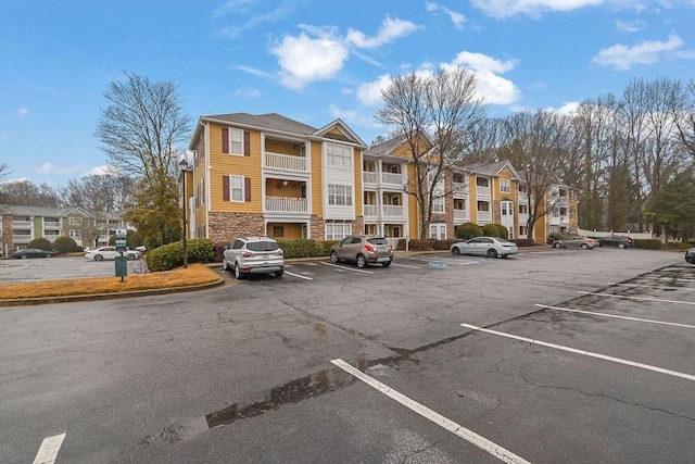 view of property featuring uncovered parking