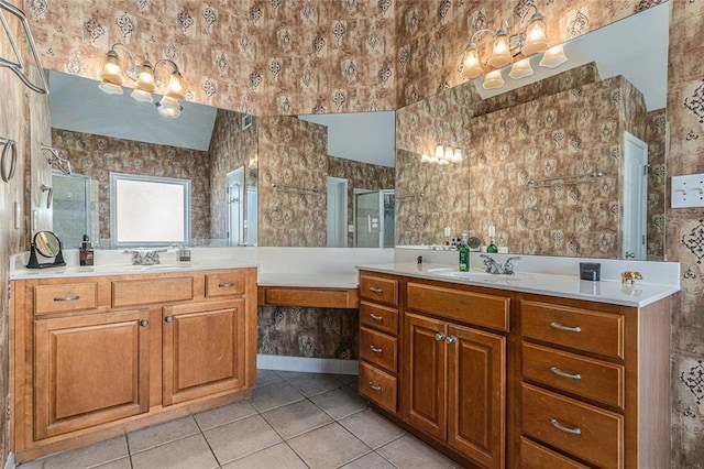 bathroom with tile patterned floors, vanity, and an enclosed shower