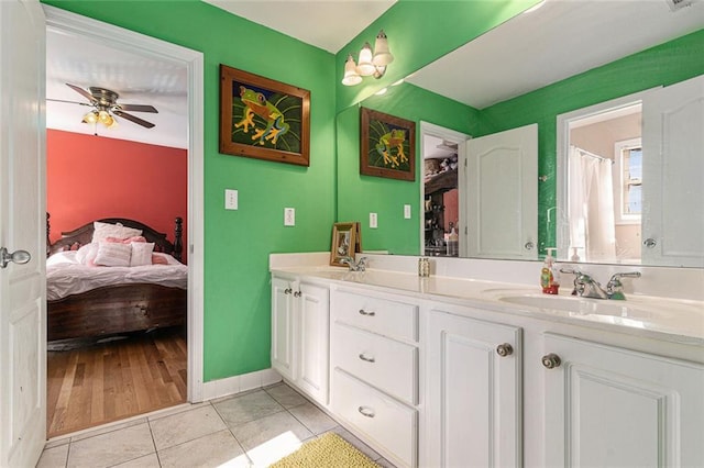 bathroom with tile patterned flooring, ceiling fan, and vanity