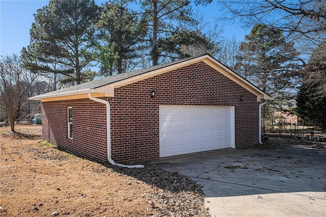 view of home's exterior with a garage and an outdoor structure