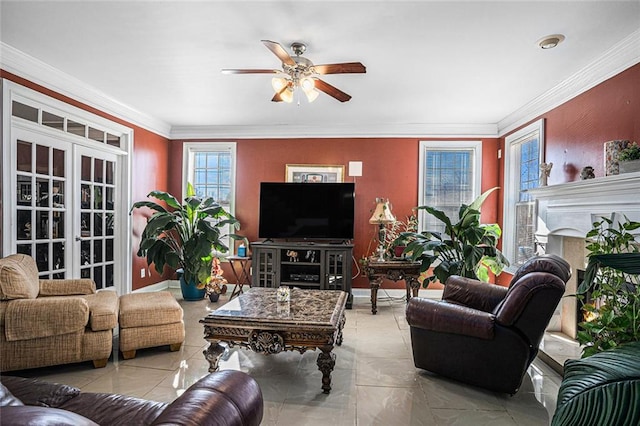 tiled living room featuring ceiling fan, a fireplace, crown molding, and french doors