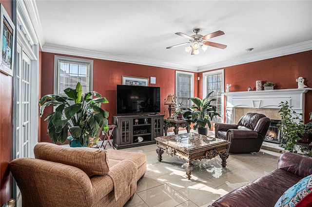 living room featuring ceiling fan, light tile patterned floors, and ornamental molding